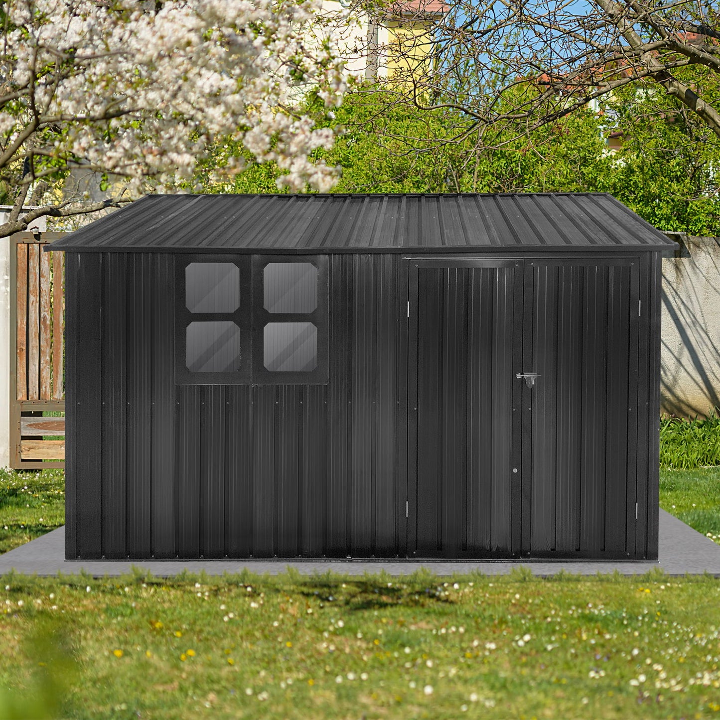 A 10' x 8' Garden Shed Outdoor Storage Shed with a window features a black metal design and closed door, set on a concrete pad amid green grass, trees, and a wooden fence in a sunny backyard.