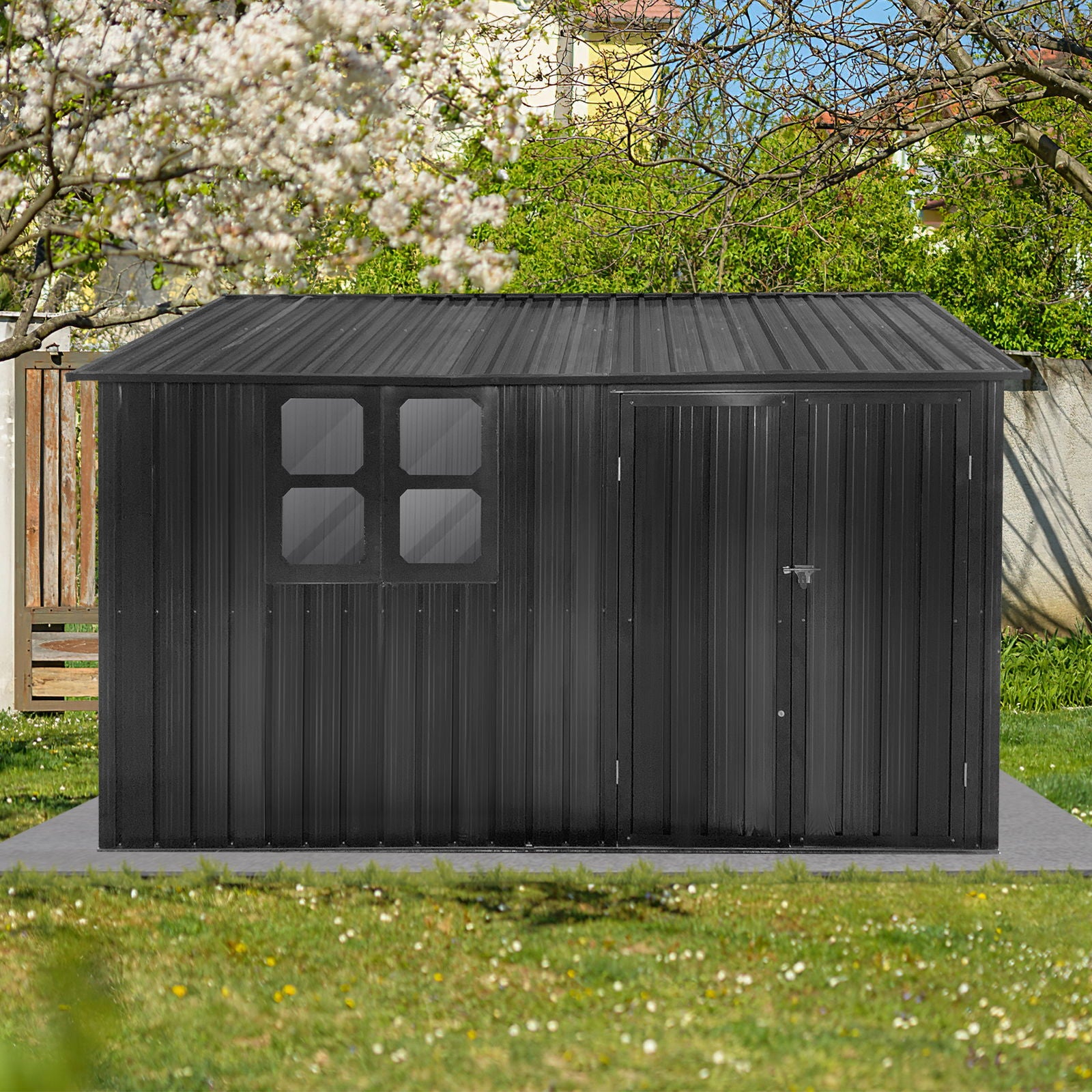 A 10' x 8' Garden Shed Outdoor Storage Shed with a window features a black metal design and closed door, set on a concrete pad amid green grass, trees, and a wooden fence in a sunny backyard.