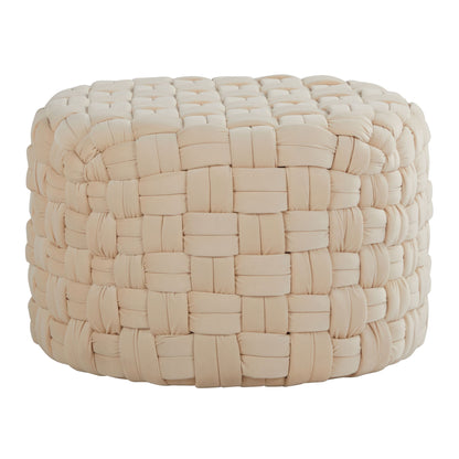The Braided - Versatile Round Ottoman features a beige woven fabric with a chunky basket weave pattern and plush cushioning, shown against a white background.