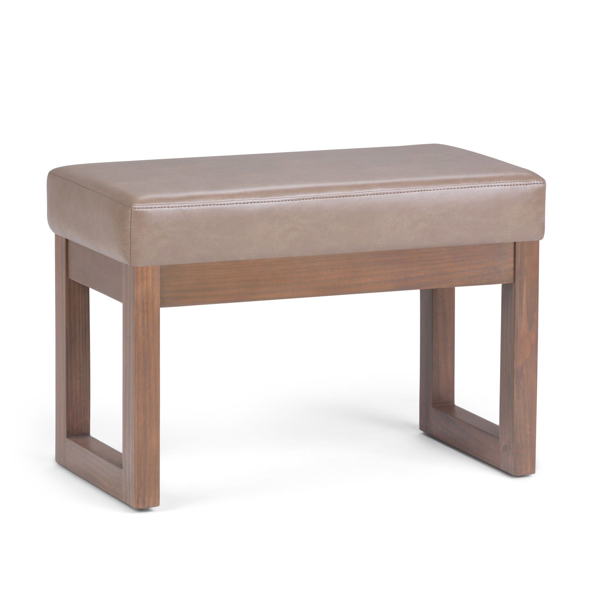 The Milltown Upholstered Ottoman Bench features a light brown cushioned seat, wooden legs, and a modern open-frame rectangular design.
