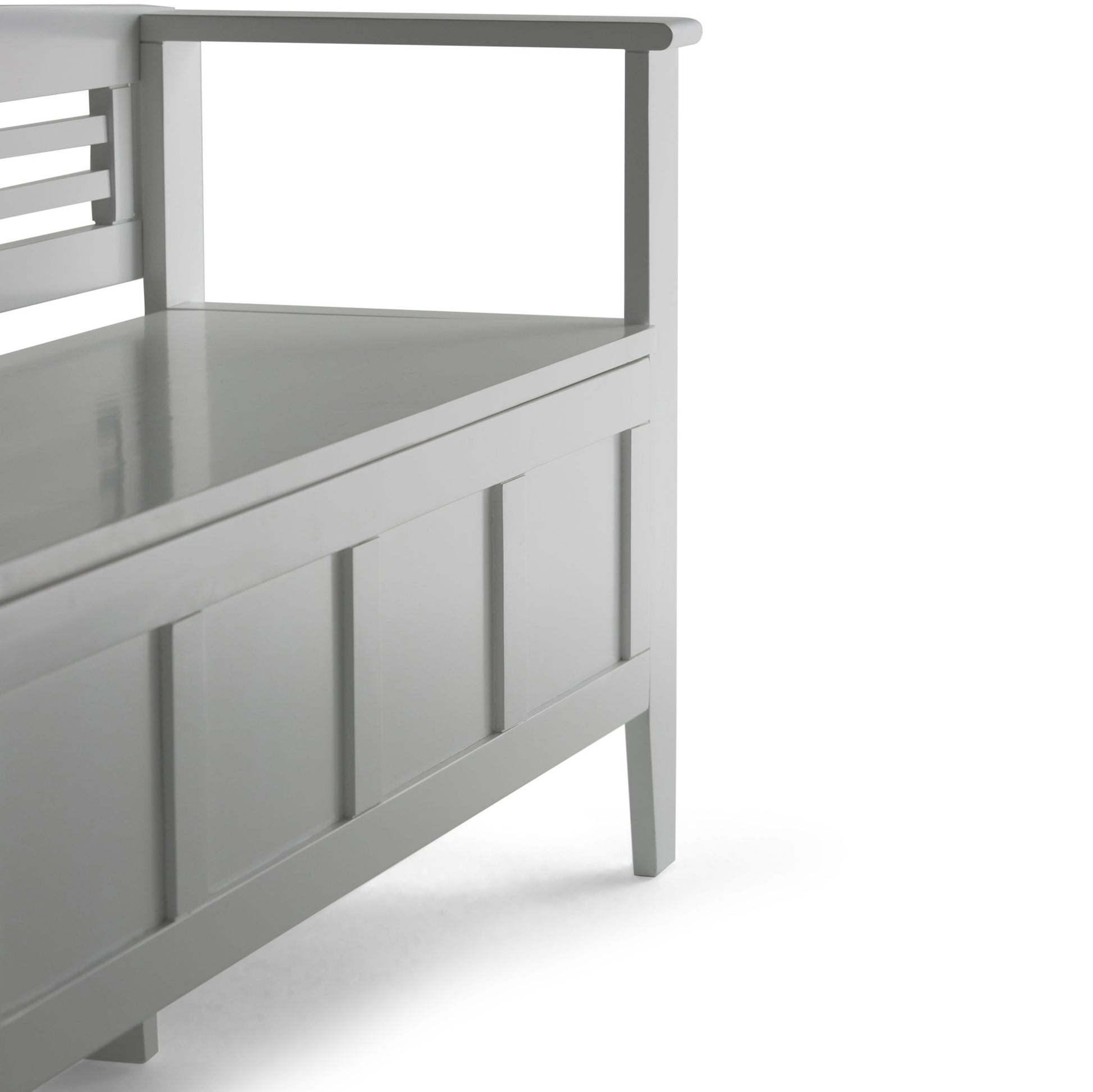 A close-up of the Adams - Entryway Storage Bench Handcrafted, featuring modern gray wood, panel detailing, armrests, and a flat seat, set against a white background.