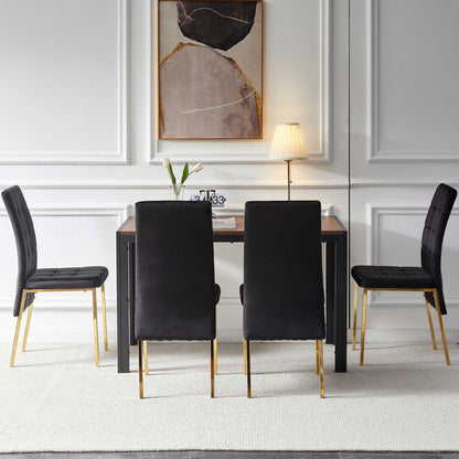 A modern dining room featuring a 5 Pieces Dining Set with velvet high back chairs, golden legs, and a creative dining table, complemented by abstract wall art and décor against white paneled walls and a light carpet.