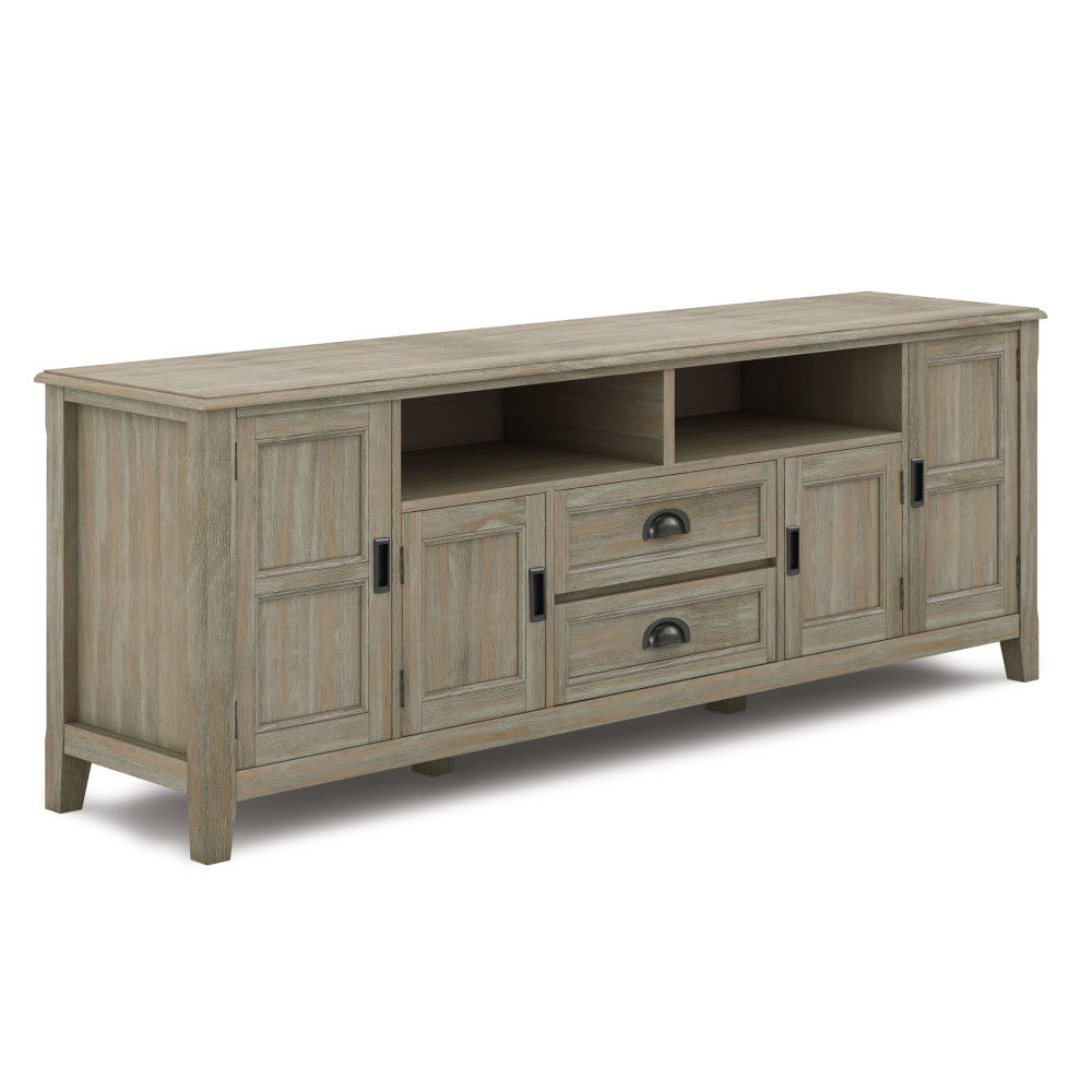 The Burlington TV Media Stand has a light gray wooden finish, two central drawers with black handles, an open shelf above, and two cabinet doors on each side.