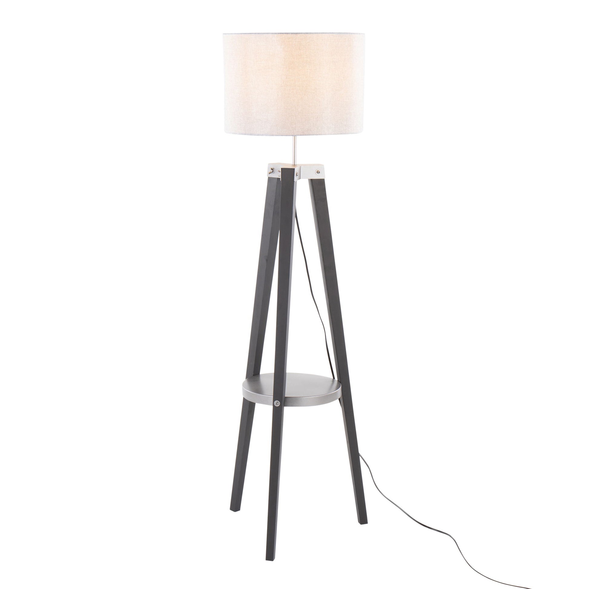 The Compass Mid Century Modern Floor Lamp features three black legs, a round white shade, a small circular shelf near the base, and a visible black power cord extending from the base.