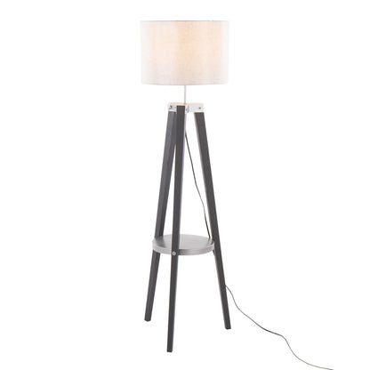 The Compass Mid Century Modern Floor Lamp features three black legs, a round white shade, a small circular shelf near the base, and a visible black power cord extending from the base.
