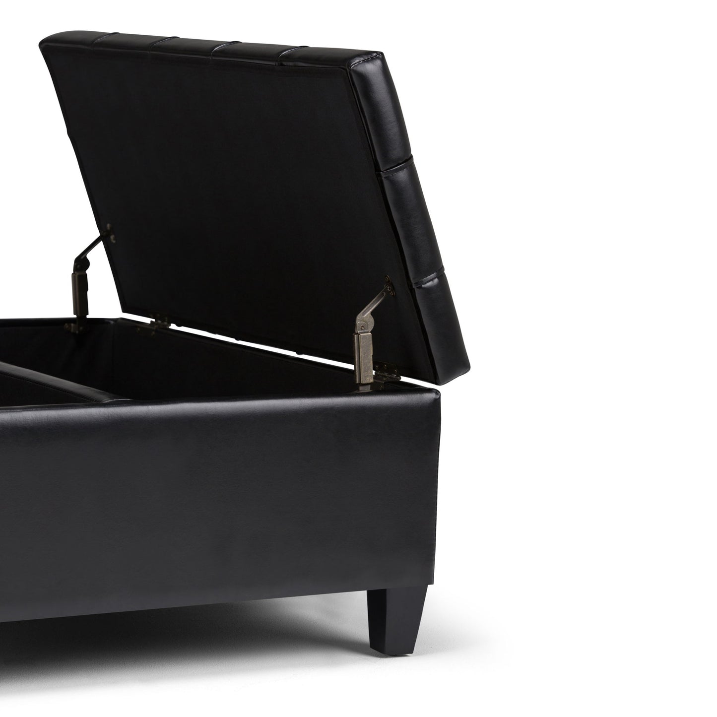 The Harrison Large Coffee Table Storage Ottoman, shown with its cushioned black lid open to reveal spacious internal storage, features short square legs and is set against a white background.
