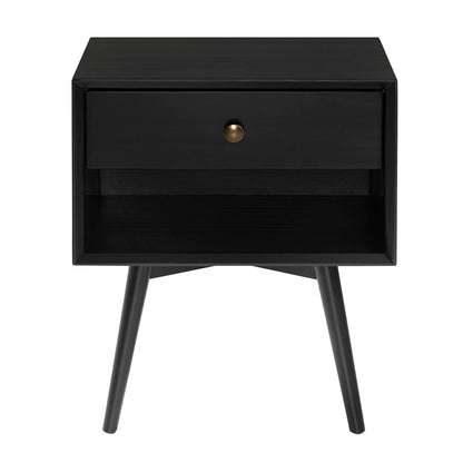 The Mid-Century Modern Single Drawer Solid Wood Nightstand features a sleek black finish, one drawer with a round brass knob, an open lower shelf, and four angled legs for a stylish, functional look.