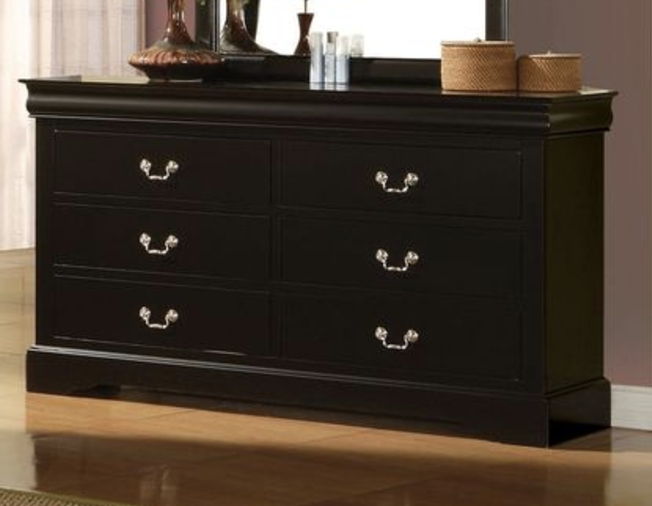 The Louis Philippe III dresser features durable black wood, six drawers with silver handles, and stands on a polished wooden floor. Decorative items and a mirror are arranged on top.