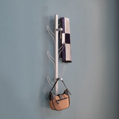 A Vertical Eight Hook Coat Rack Wall Mount displays a black-and-white striped scarf and a tan handbag against a plain blue wall.