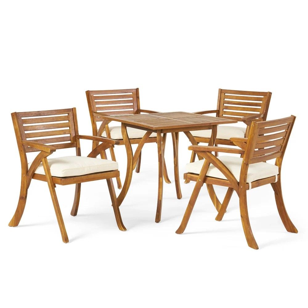 The Outdoor Hermosa 5 Piece Wood Dining Set with Cushions in Teak/Beige includes a square table and four matching slatted-back chairs with arms and beige cushions, displayed on a white background.