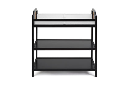 The Brees - Changing Table is a black wooden baby changing station with two open shelves and a white changing pad on top, displayed against a plain white background.