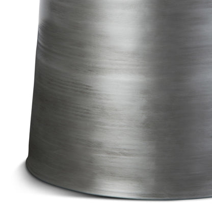 The Toby - Handcrafted Metal Accent Table features a cylindrical brushed metal form with a smooth, slightly reflective surface and subtle horizontal streaks, displayed against a white background.