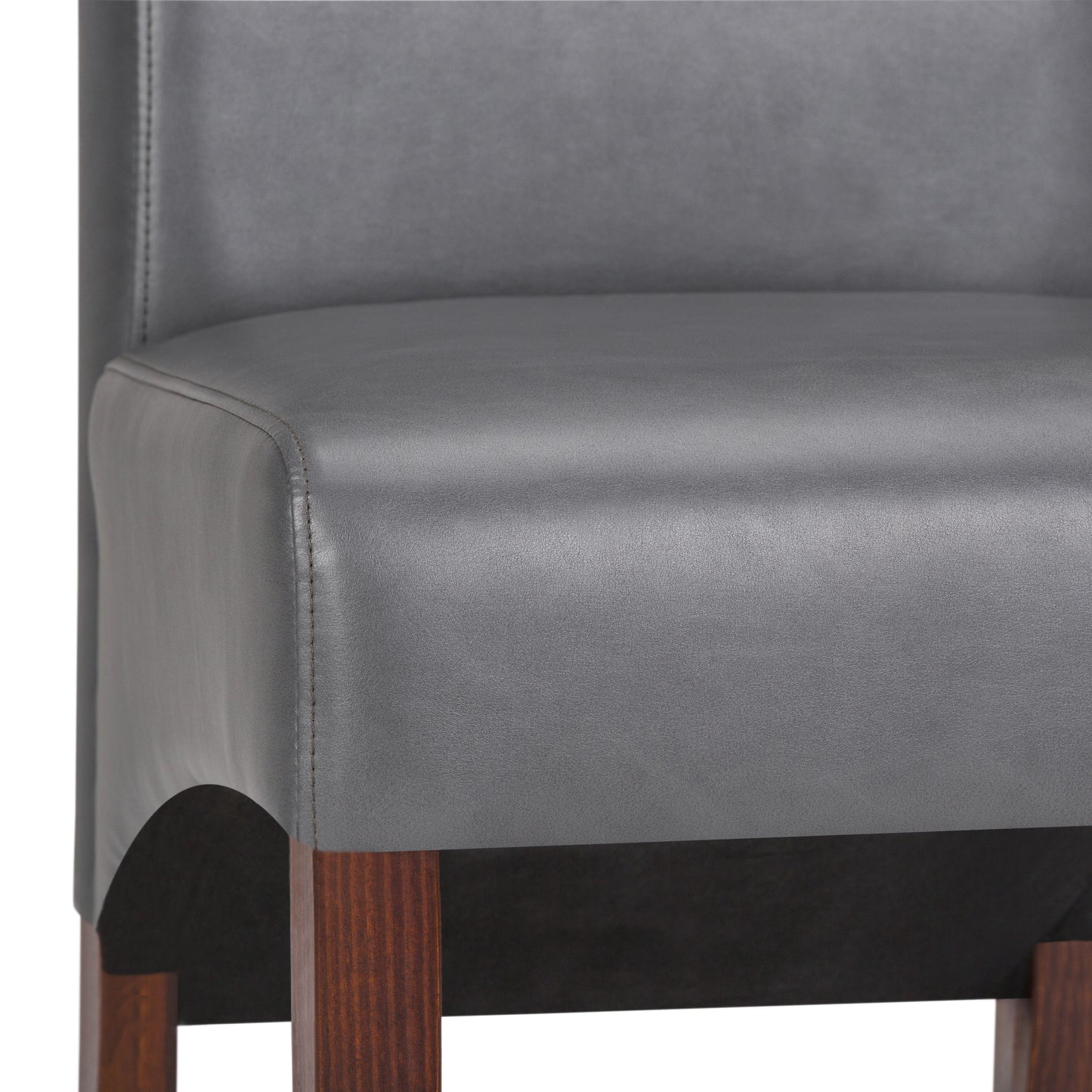 Close-up of the Avalon - Deluxe Parson Dining Chair (Set of 2), showing its smooth gray upholstered seat and backrest with dark wooden legs. The image highlights the lower backrest, seat, and upper leg area.