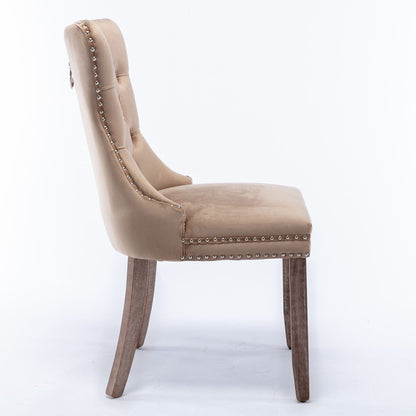 Side view of the Nikki modern velvet upholstered dining chair set, featuring a beige tufted back, silver nailhead trim, and solid wood legs on a white background.