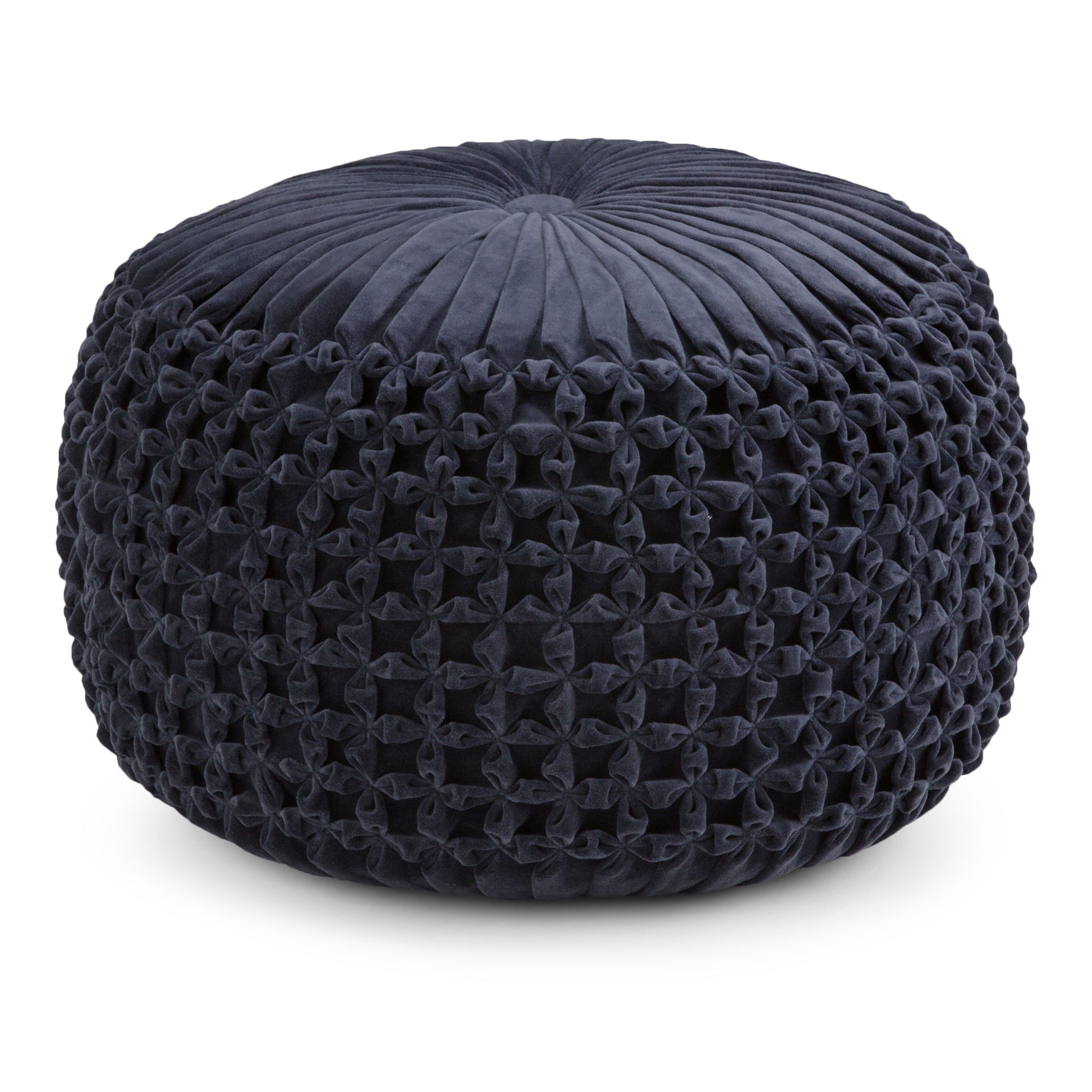 The Renee - Handcrafted Round Pouf features a round, dark blue design with a pleated and tufted velvet top and intricately woven, knotted sides.