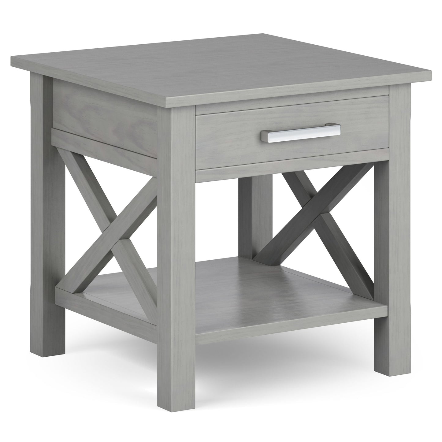 The Kitchener - Handcrafted Table is a gray wooden end table with a single drawer, metal handle, X-shaped side supports, and a lower open shelf.