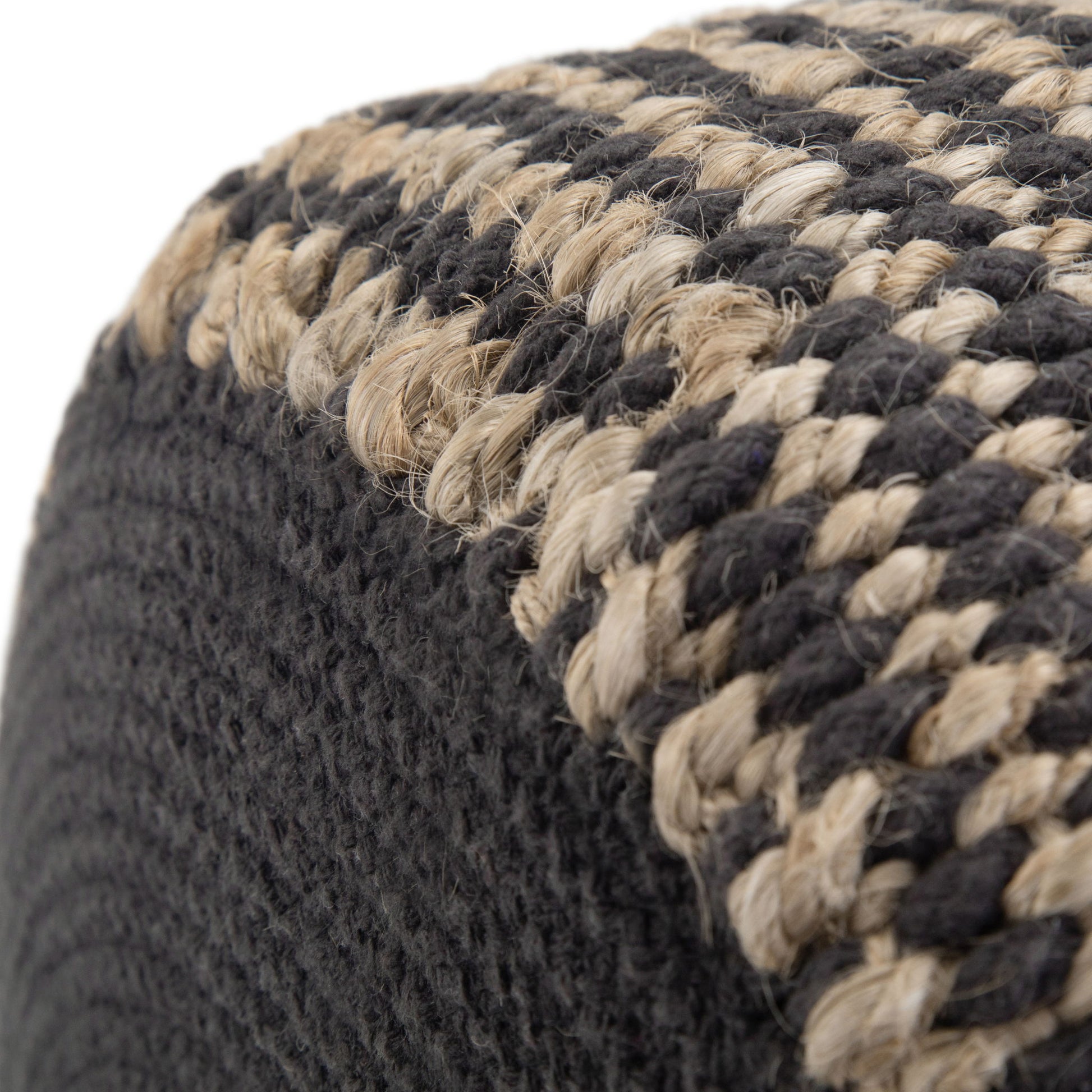 Close-up of the Larissa Handcrafted Round Braided Pouf, showcasing its tightly knit weave and checkered pattern in natural beige and dark gray fibers for a textured, artisanal look.