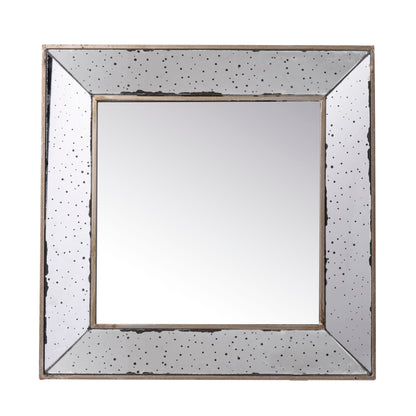The Distressed Accent Mirror is a traditional style wall mirror with a wide, antique-look frame featuring speckled black spots and a slightly distressed finish, perfect for adding vintage charm to your living room.