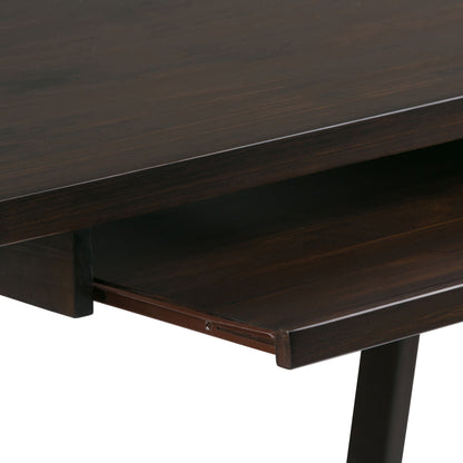 Close-up of the Sawhorse - Handcrafted Desk showcasing a dark wooden finish and a sliding keyboard tray partially pulled out beneath the tabletop.