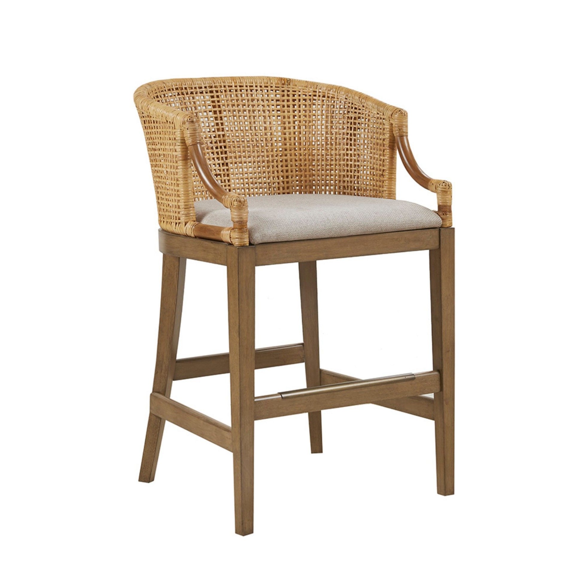 The Casual Handcrafted Rattan Counter Stool features a natural woven rattan backrest, curved arms, a light beige upholstered seat, and sturdy wooden legs with footrest supports.