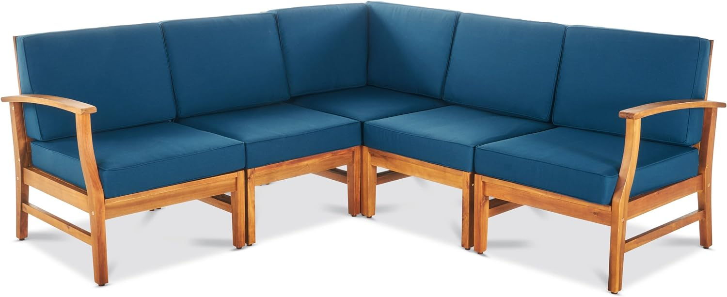 The Perla - 5 Pieces Sofa Set is an L-shaped sectional with a wooden frame, blue seat and back cushions, and armrests at each end.