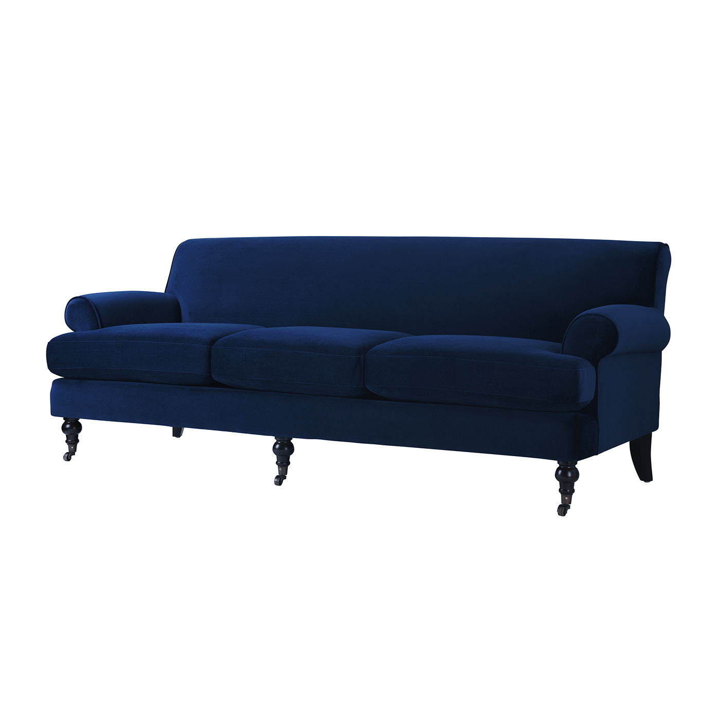 The Alana Lawson Three Cushion Tightback Sofa features navy blue velvet upholstery, three seat cushions, rounded arms, and black turned wooden legs with casters.