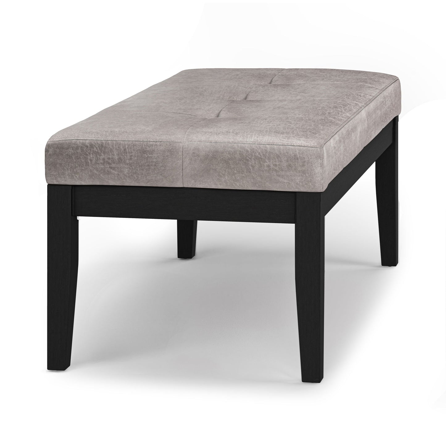 The Lacey Upholstered Tufted Ottoman Bench features a light gray cushioned seat with tufting and black wooden legs, shown against a plain white background.