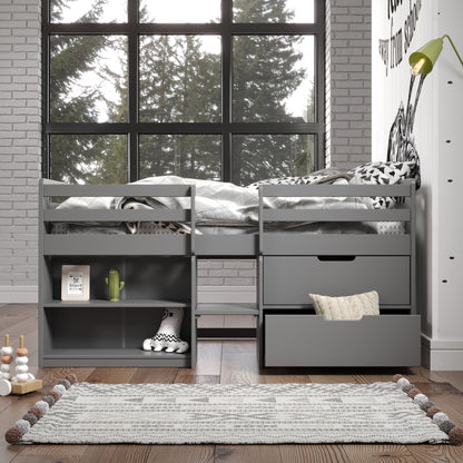 The Fabiana Twin Loft Bed With Storage in gray features built-in shelves and drawers, arranged in a bright room with a large window, wood floor, and patterned rug. Toys, books, and decor are neatly displayed on the shelves.