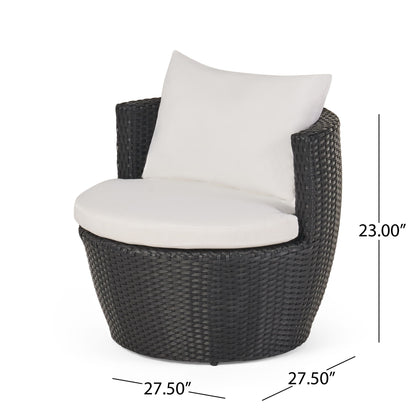 The Kono - Chat Set Outdoor Furniture features a round black wicker chair with a curved back, white seat cushion, and white back pillow. Dimensions: 23"H x 27.5"W x 27.5"D.