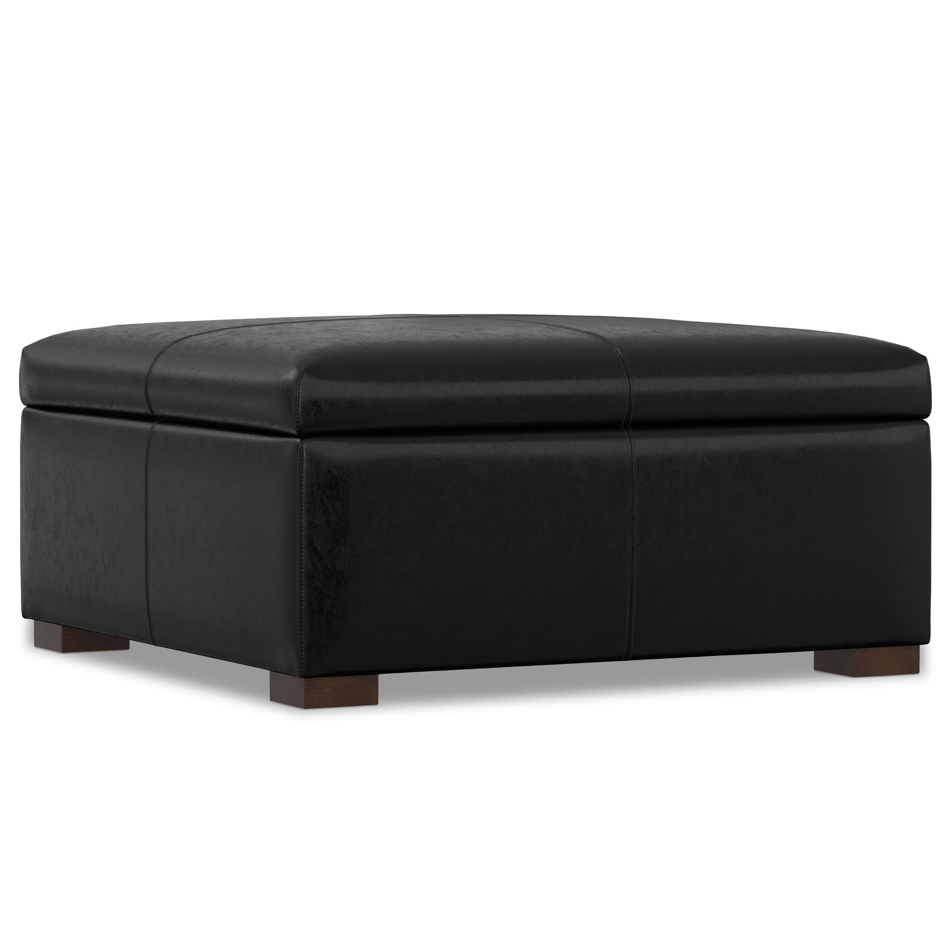 The Gabbie - Coffee Table Upholstered Storage Ottoman is a large, square black leather piece with subtle stitching and short wooden block feet, shown on a white background.