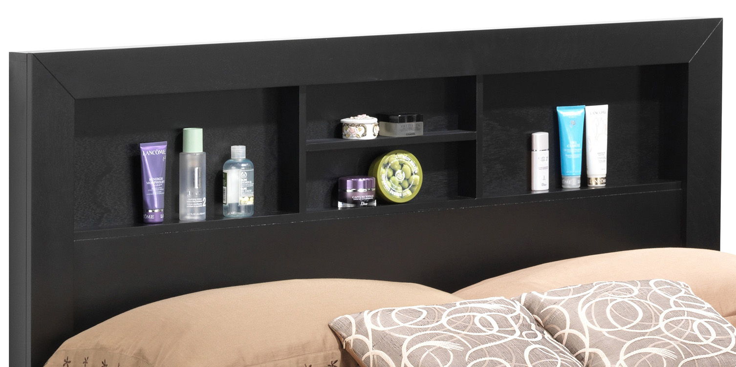 The Bed With Transitional Design Stylish features a black headboard with built-in shelves showcasing toiletries and skincare products, set behind beige pillows with circular patterns.