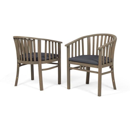 Set of 2 Outdoor Wooden Dining Chairs with curved backs, vertical slats, and dark cushioned seats. The chairs are angled to display both the front and back views.