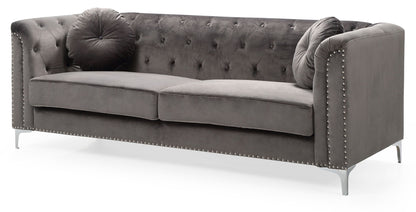 The Elegant Contemporary Sofa features gray velvet upholstery, a button-tufted back and arms, silver nailhead trim, slim metal legs, and includes two round throw pillows for a modern, elegant look.