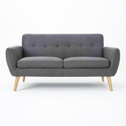 The Modern Loveseat Sofa With Button Tufted Backrest features gray fabric upholstery, a tufted backrest, curved armrests, and angled wooden legs, displayed against a plain white background.