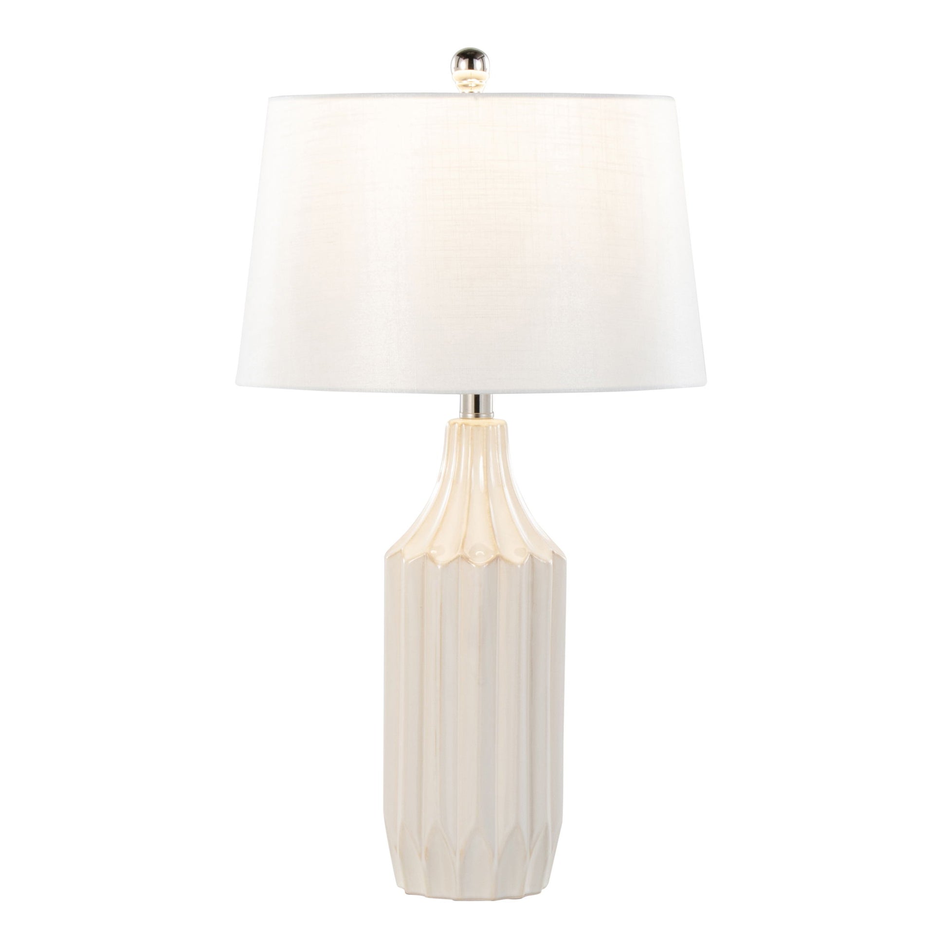 The Stella - Contemporary Table Lamp features a white, faceted ceramic base, a large round white fabric shade, and a silver finial on top for a sleek, minimalist look.