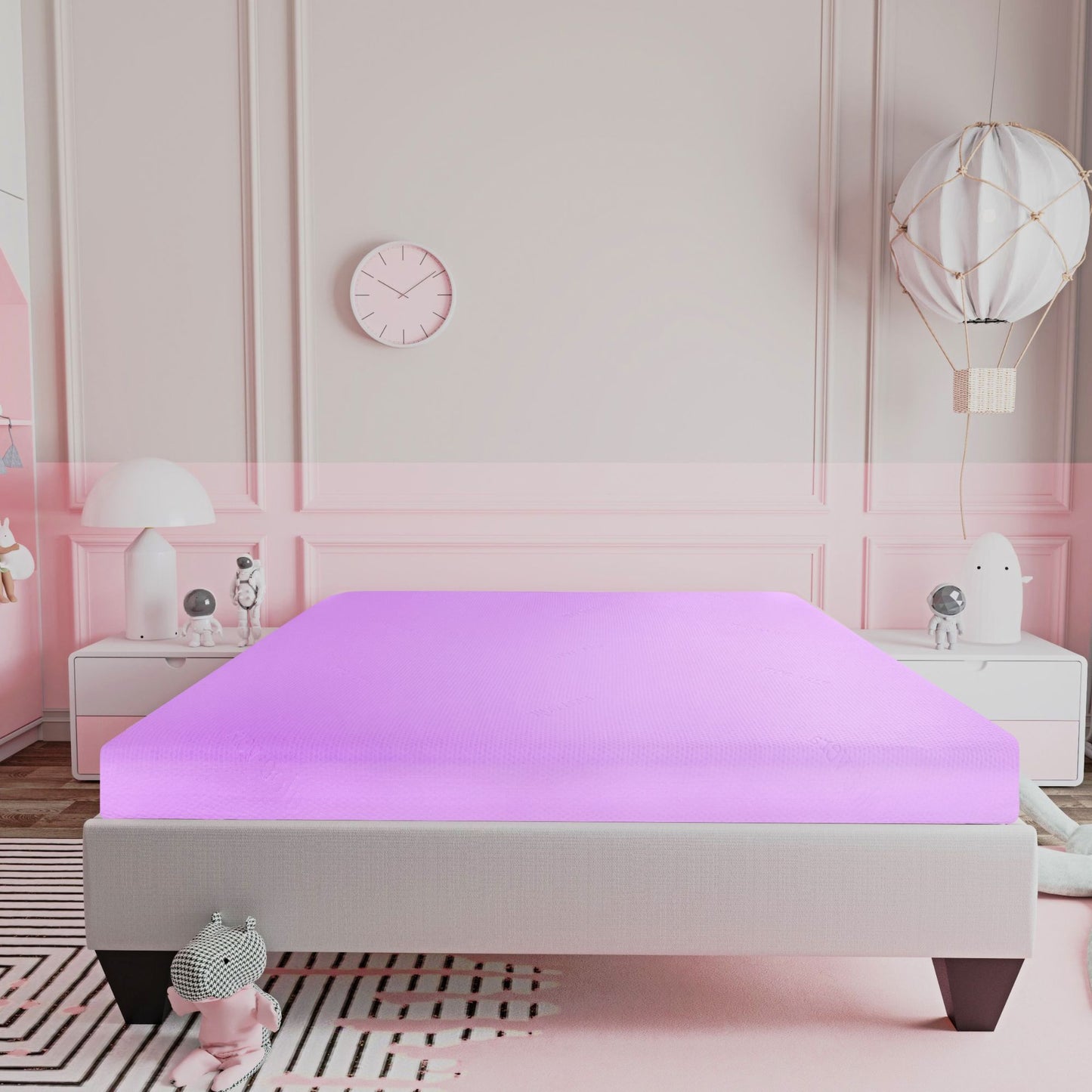 A modern bedroom with a soft pink and white color scheme features the 6" Full Size Gel Memory Foam Mattress In A Box With Aloe Vera Cover - Pink, white nightstands, decorative accents, and a large balloon-shaped ceiling lamp.