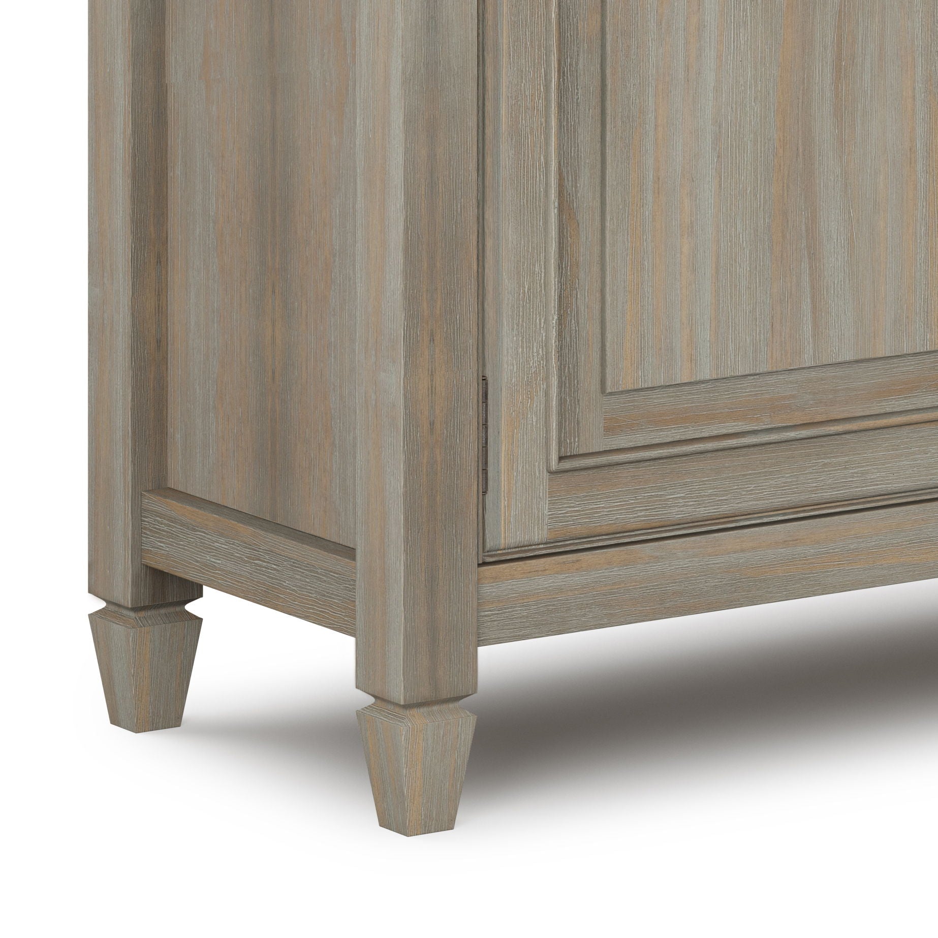 Close-up of the bottom corner of the Connaught Entryway Storage Cabinet in distressed gray, featuring tapered legs.