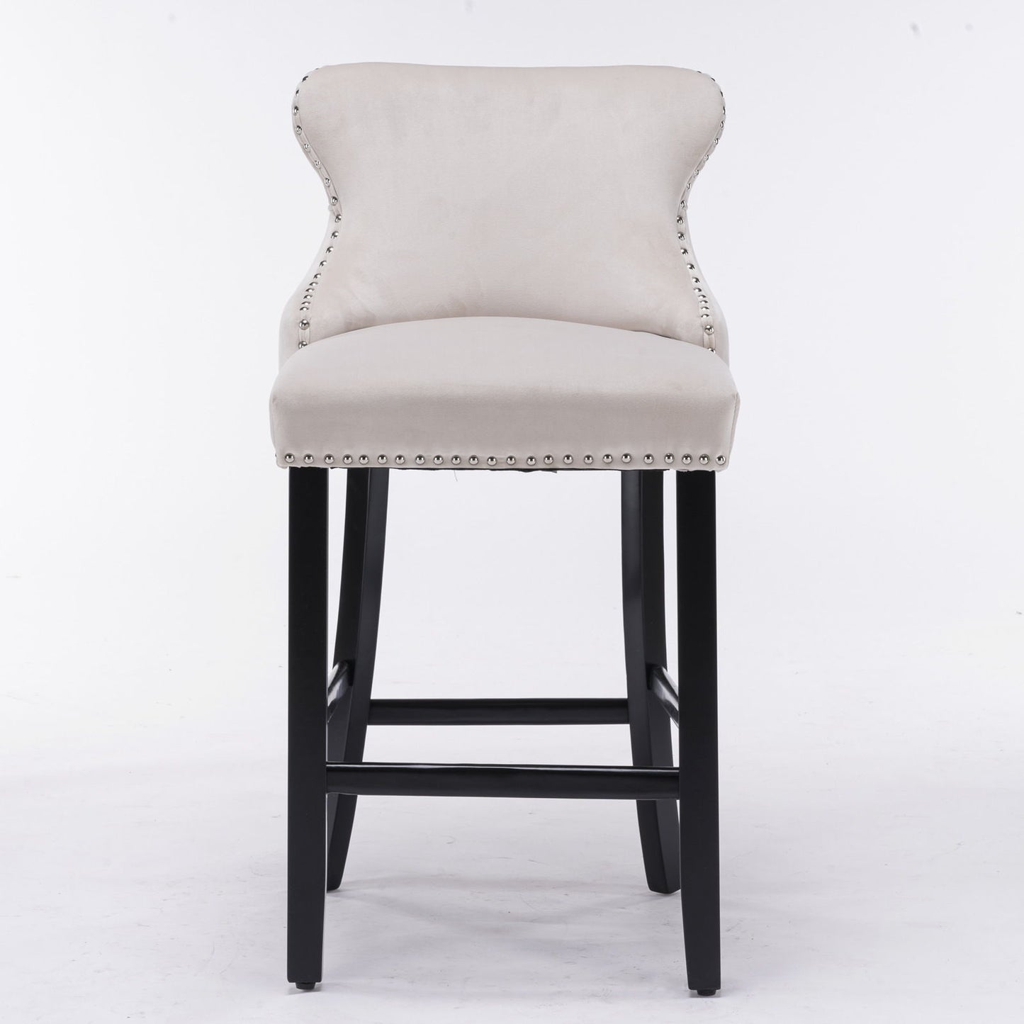 A set of 2 contemporary wing-back barstools with velvet upholstery, button tufting, chrome nailhead trim, and dark wooden legs shown on a white background.
