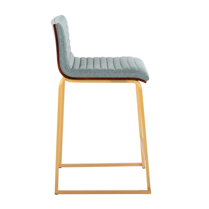 Profile view of the Mason Mara counter stool, part of a set of two, featuring a sleek quilted light blue upholstered seat and backrest. The modern design is complemented by a thin rectangular gold-colored metal frame.