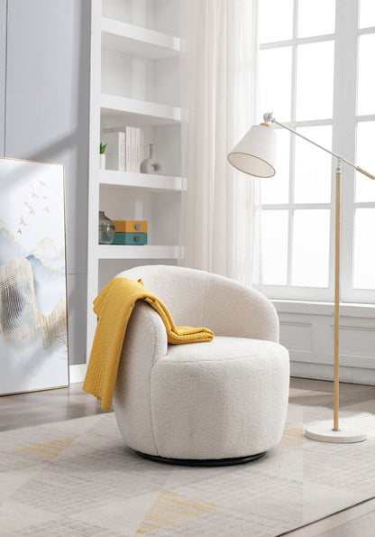 A Teddy Fabric Swivel Accent Armchair Barrel Chair with a yellow blanket over the arm sits by a tall floor lamp in a bright room with large windows, light curtains, shelves, and framed art on the floor.