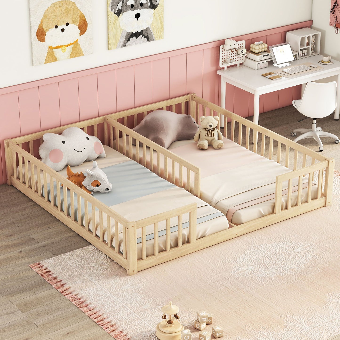 A cozy children's bedroom features a Double Floor Bed With Fence, Guardrails, Without Door, each bed with stuffed animals, a pink rug, a desk with chair and computer, and animal art above pink wainscoting.