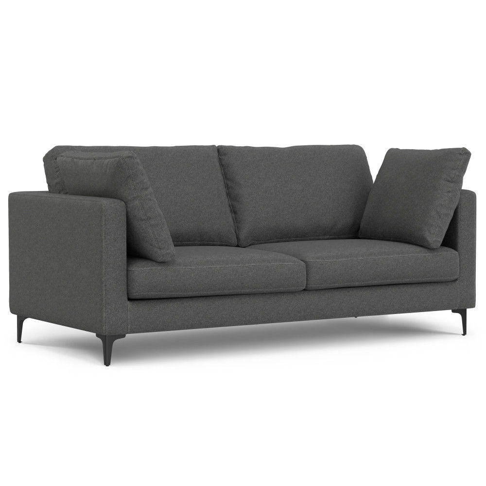 The Ava Mid Century Sofa With Ottoman Set features dark gray fabric, two seat and back cushions, straight armrests, four black angled legs, and includes two matching throw pillows. Shown on a white background.