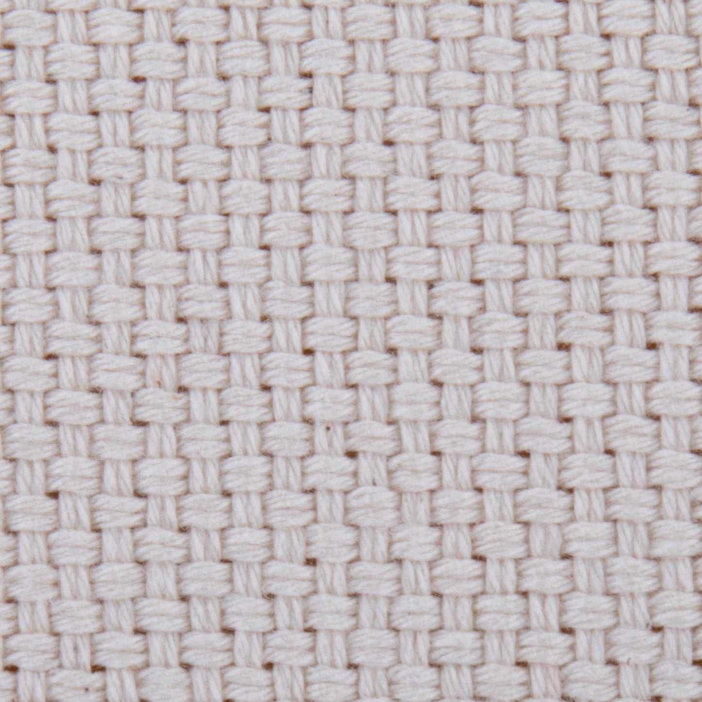 Close-up of the Large Round Pouf - Knitted Beige, featuring thick, tightly interlaced threads in a basket weave pattern. The textured surface has small, evenly spaced square holes for a distinct grid-like look.