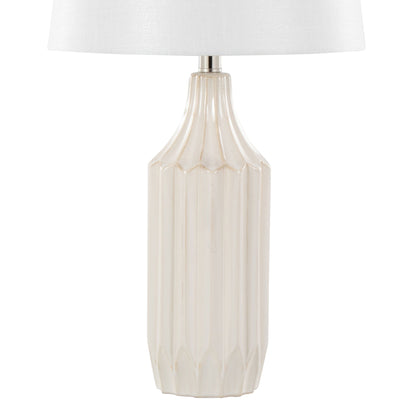 The Stella - Contemporary Table Lamp features a light beige, ribbed ceramic base and a simple white fabric shade.