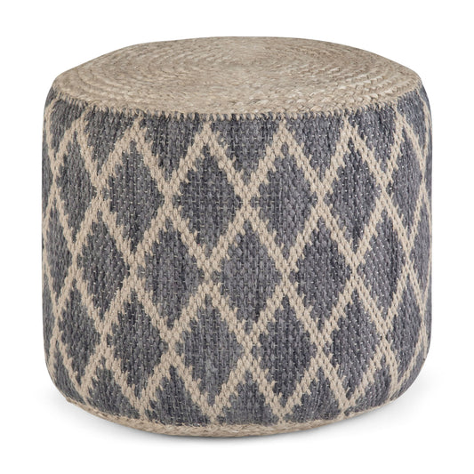 The Edgeley - Handcrafted Round Pouf features a blue-gray base with a beige diamond pattern, a flat top, and a textured woven surface.