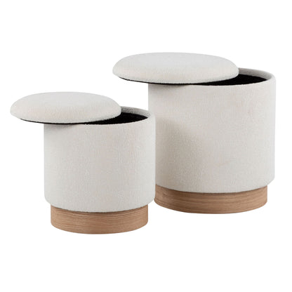 The Marla Contemporary Nesting Ottoman Set in Natural/Cream features two round, white upholstered ottomans with wooden bases and removable lids, shown with lids open to reveal storage. One ottoman is slightly taller for convenient nesting.