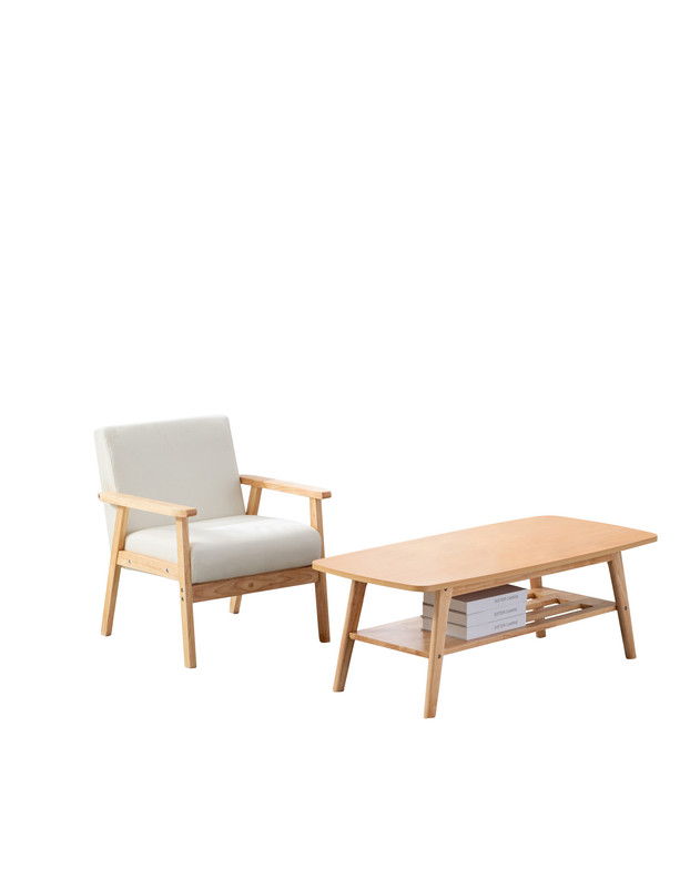 The Bahamas - Coffee Table And Chair (Set of 2) features a wooden armchair with light cushions beside a rectangular coffee table with a lower shelf for books, all displayed against a plain white background.