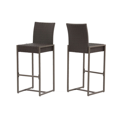 Set of 2 Outdoor Barstools with hand-crafted woven rattan seats and backs, straight metal legs, and footrests. The stools are placed side by side, angled slightly away from each other.