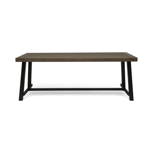 A modern, minimalist outdoor dining table featuring a gray top and rustic metal legs, shown against a white background.