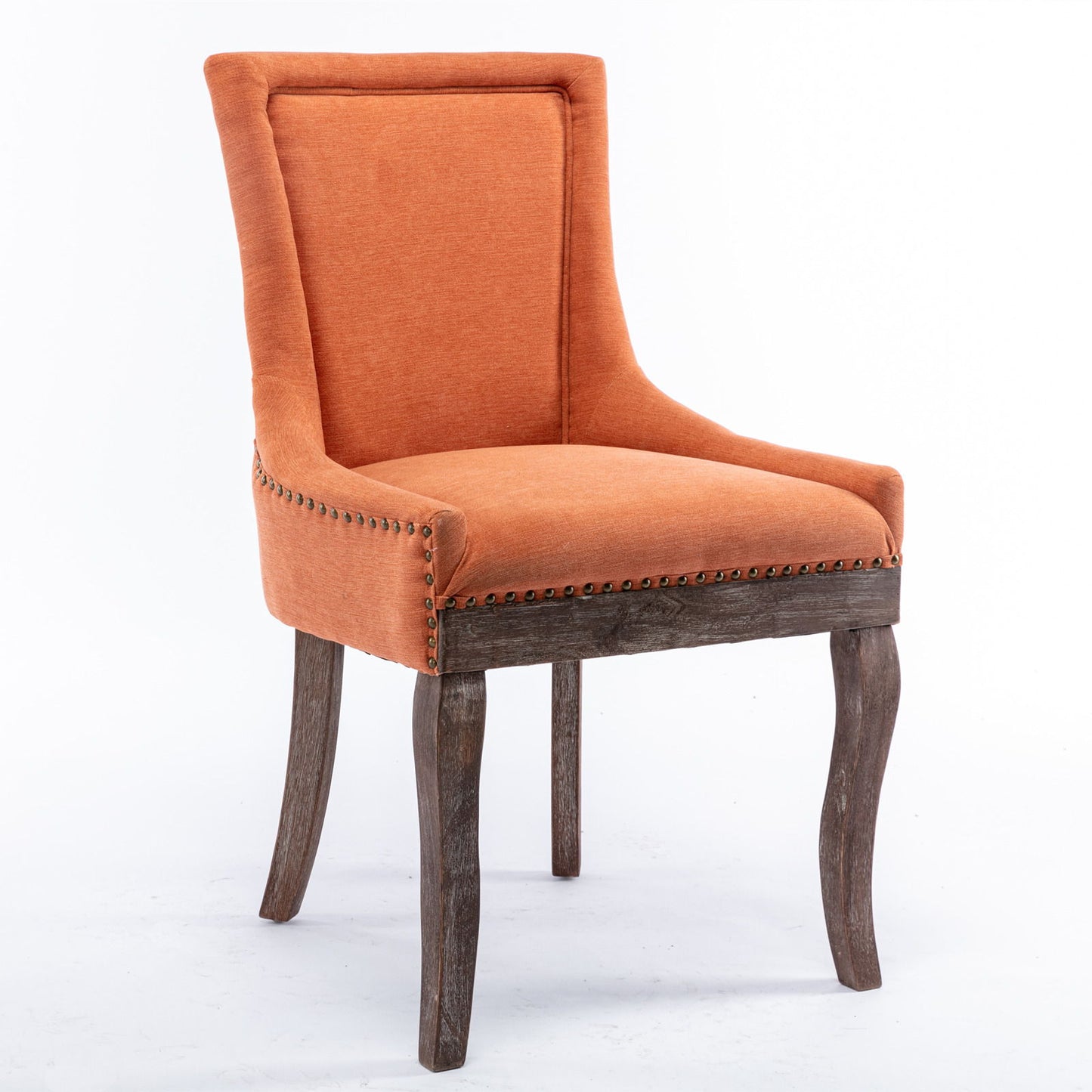 The Ultra Side Dining Chair features thickened orange upholstery, a high back, and bronze nailhead trim atop neutrally toned solid wood legs, shown in a set of 2 against a plain white background.